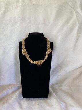 Gold Tone Multi Strand Woven Knot Statement Necklace